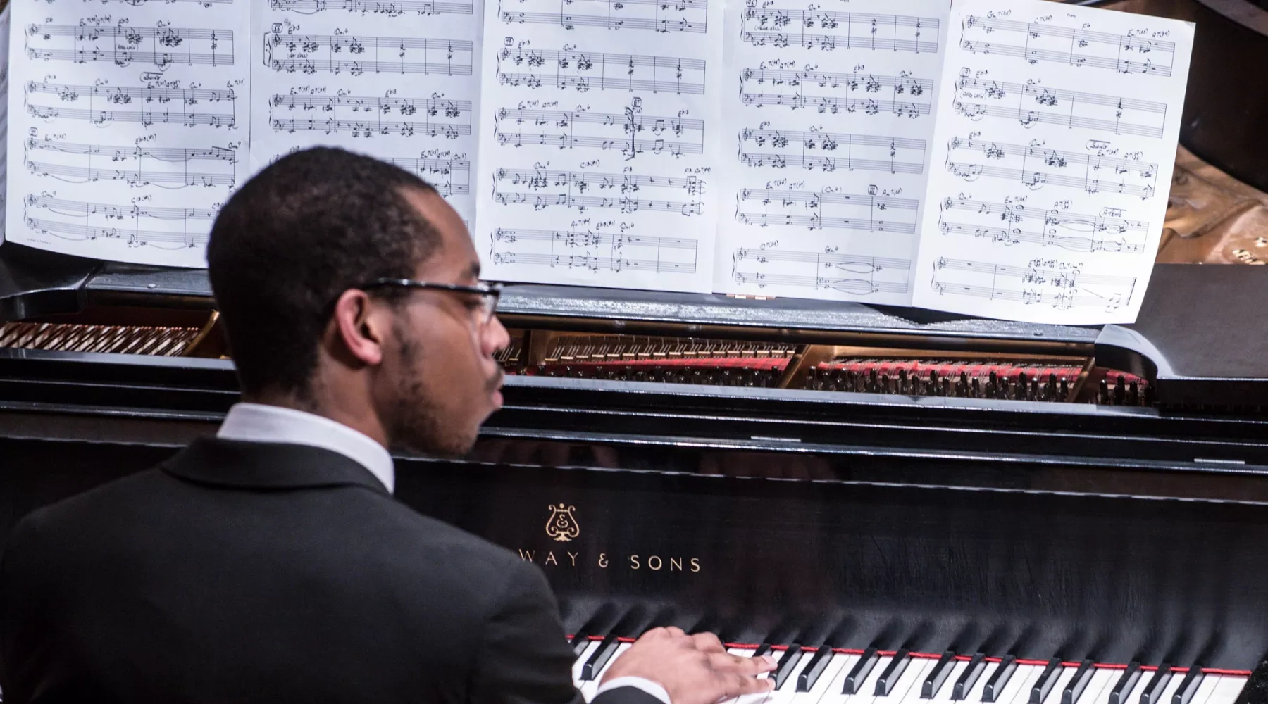 Music student playing the piano