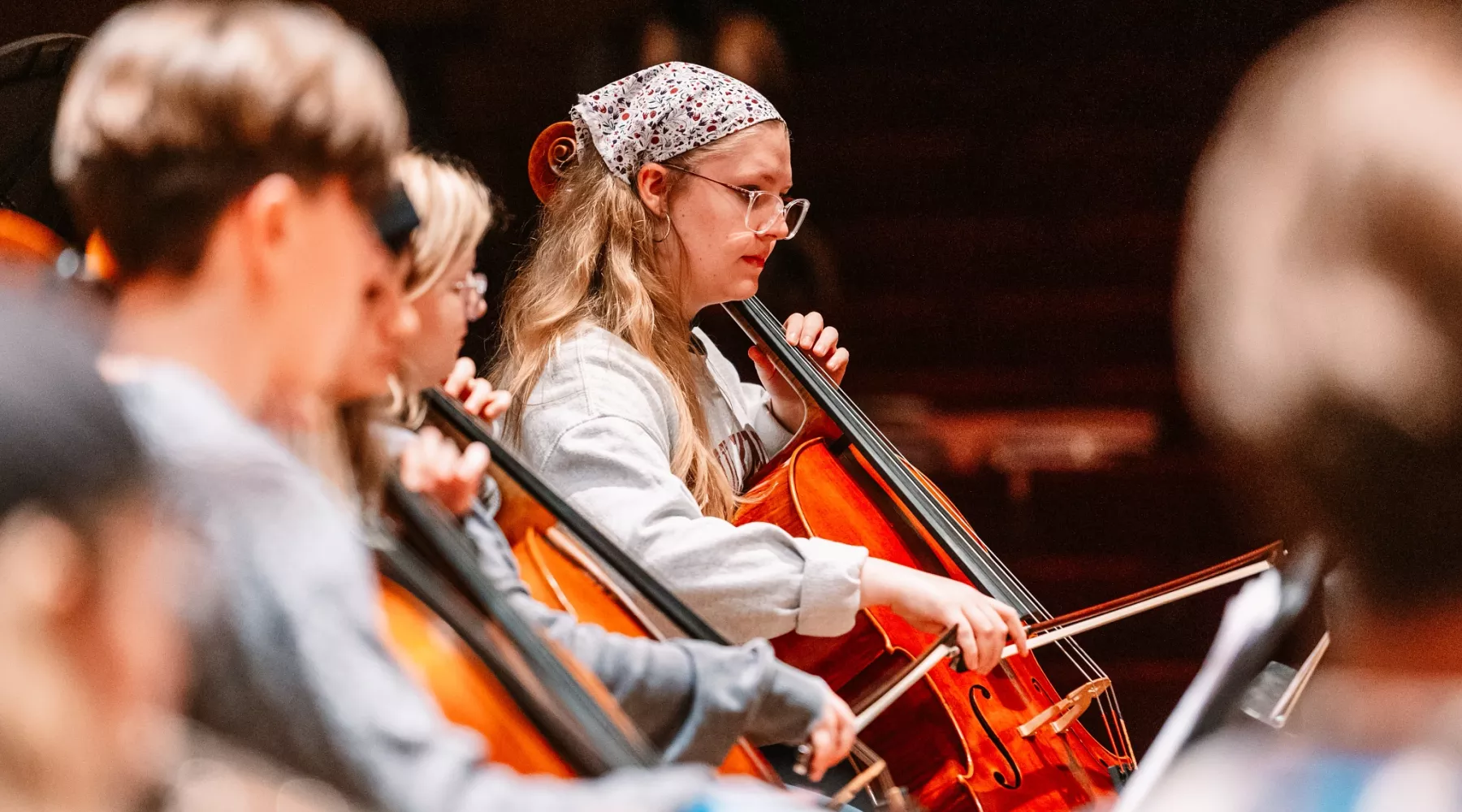 Student playing cello at Symphony Orchestra concert