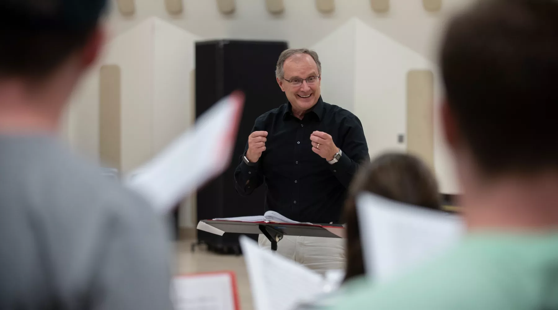 Close-up of professor in a Cardinal Singers class