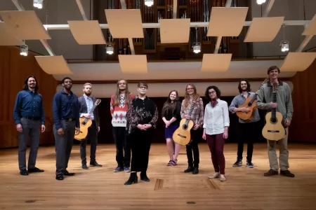 Music students pose with their guitars
