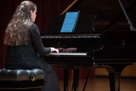 Student playing piano